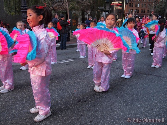 Fan girls smiling in Chinese New Year parade in San Francisco