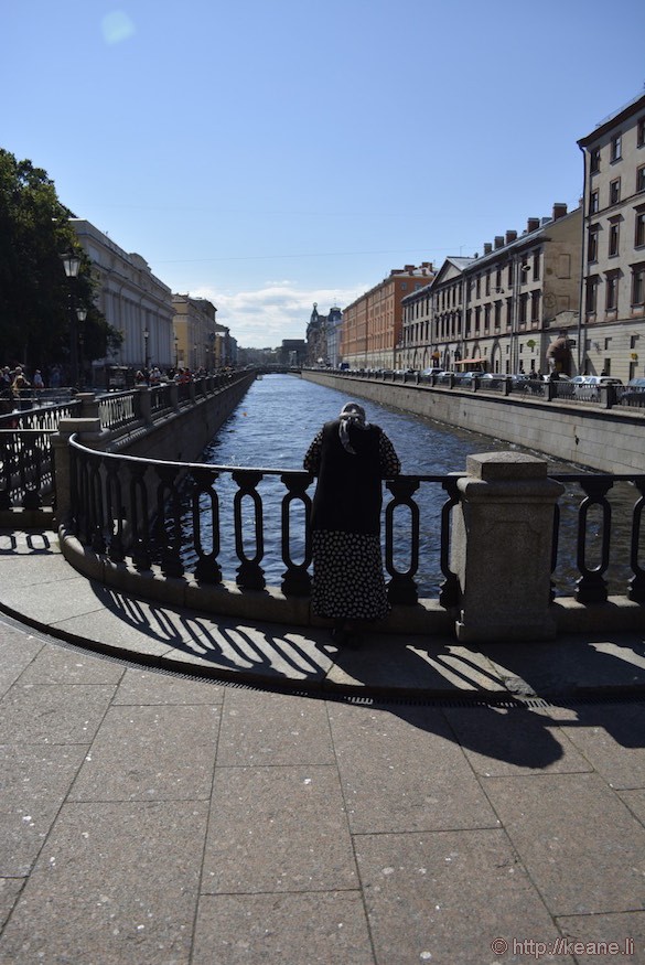 Woman Stands by St. Petersburg Canal