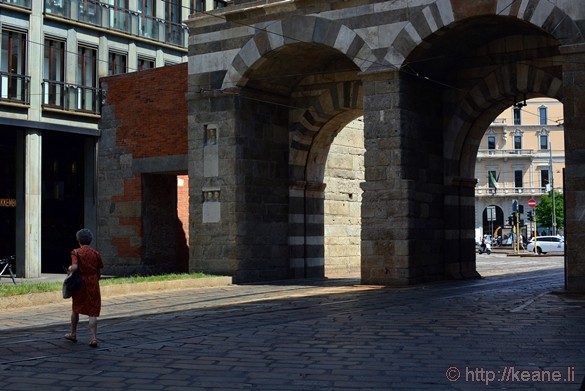 Woman Walking by Ancient Arches in Milan