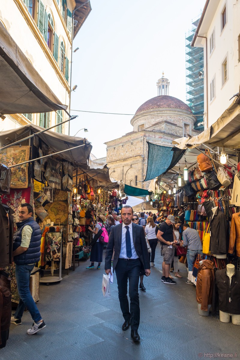 Man Walks Through the Mercato San Lorenzo